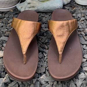 Brown fit flop slippers